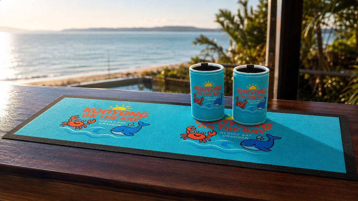 Custom bar mat with a bright cartoon beach design and matching stubby coolers