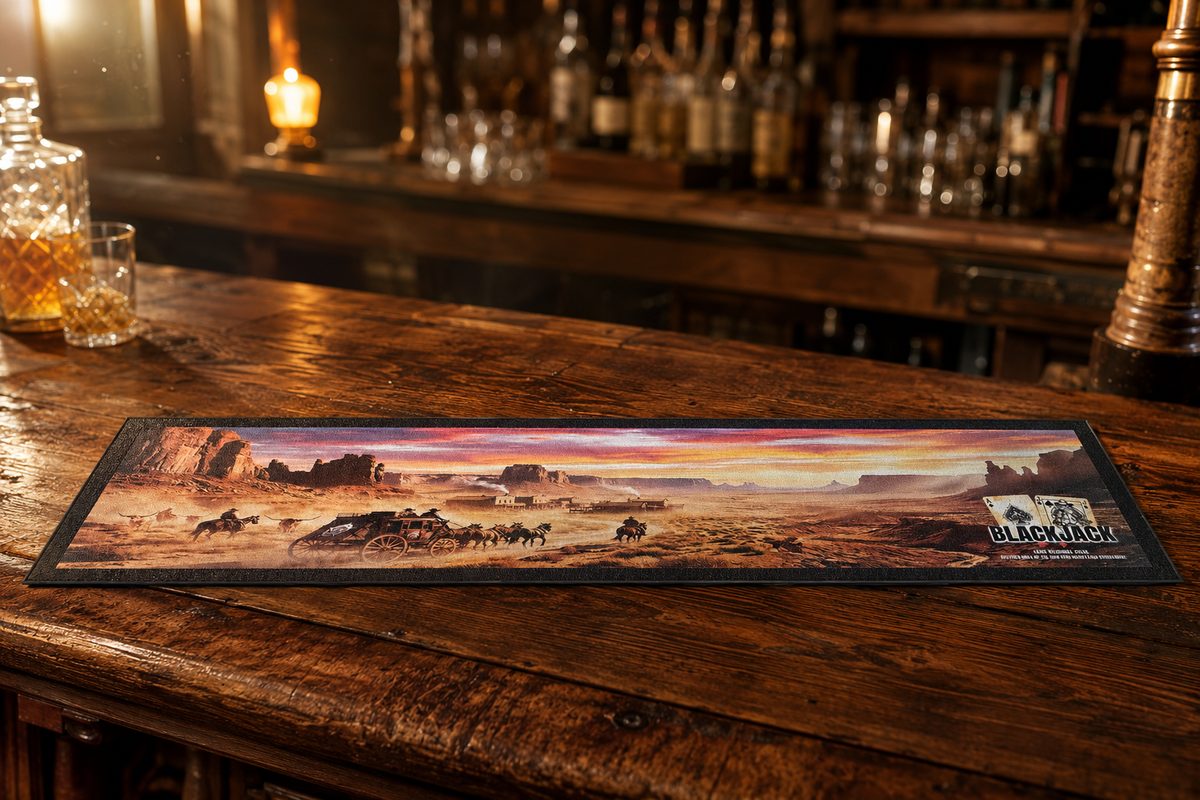 Custom bar mat with a sublimated outback sunset scene of a stagecoach crossing the desert, on a timber bar